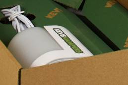 creating the promotional packaging from generic printing sheets with a wallpaper affect logo pattern.